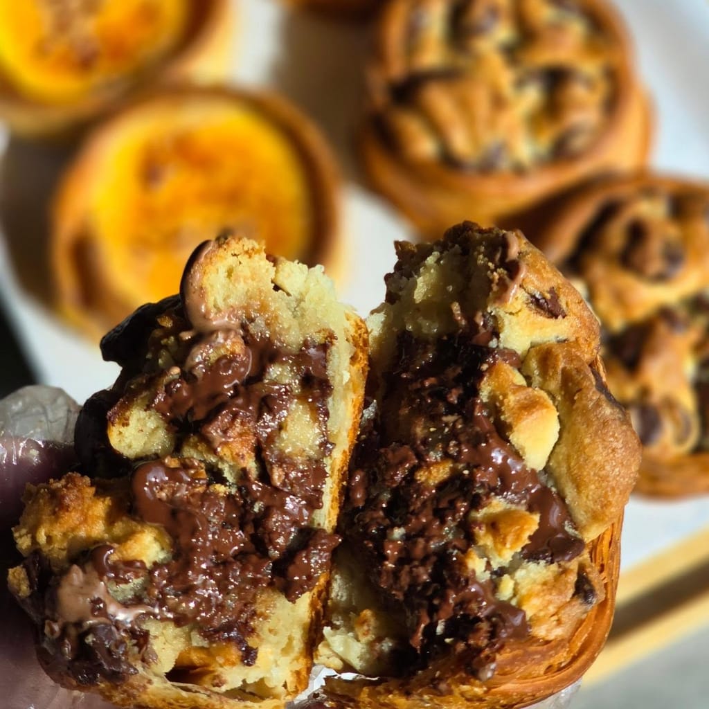 A cookie-croissant cross section with molten chocolate centre
