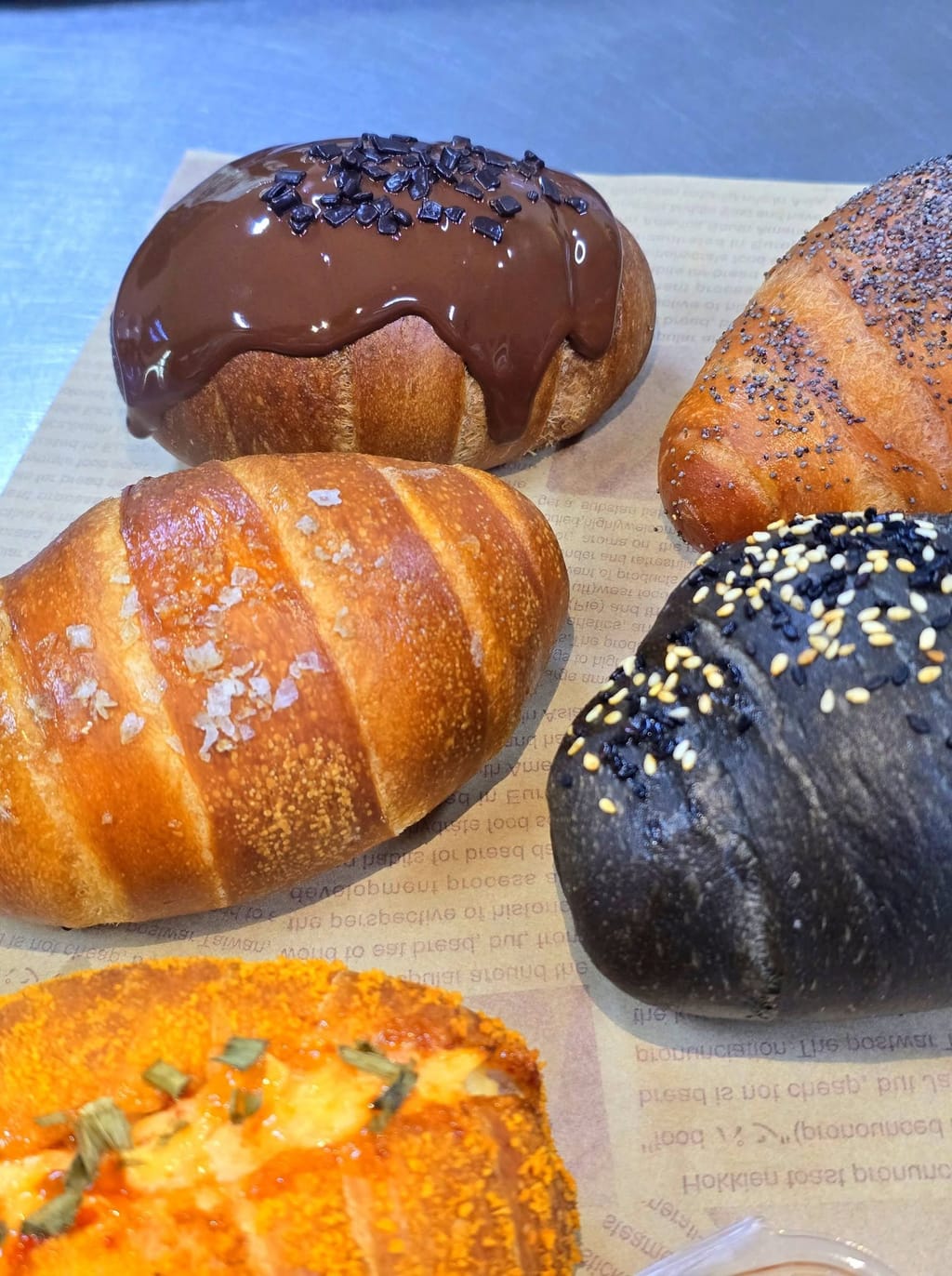 Sea salt, poppy seed, black sesame charcoal and chocolate-glazed butter croissants